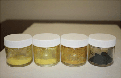 From right to left, anhydrous FeCl3 (black), 1 : 1, 1 : 3, and 1 : 4 by weight FeCl3 on CAB-O-SIL®. The samples change in colour from light orange to bright yellow.