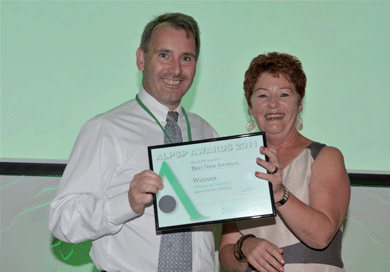 Acting Managing Director, James Milne collects the ALPSP Best New Journal Award.
